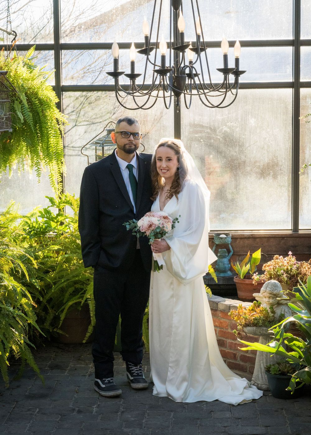 A series of wedding photos showing a couple in an indoor garden setting with large windows and ferns.