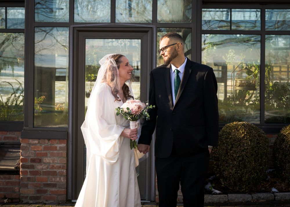 A series of wedding photographs showing couples posing together outside a venue with glass windows.