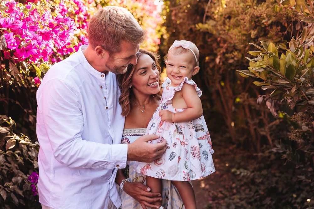 Natural lifestyle family portraits in Santa Barbara flowers with golden hour light