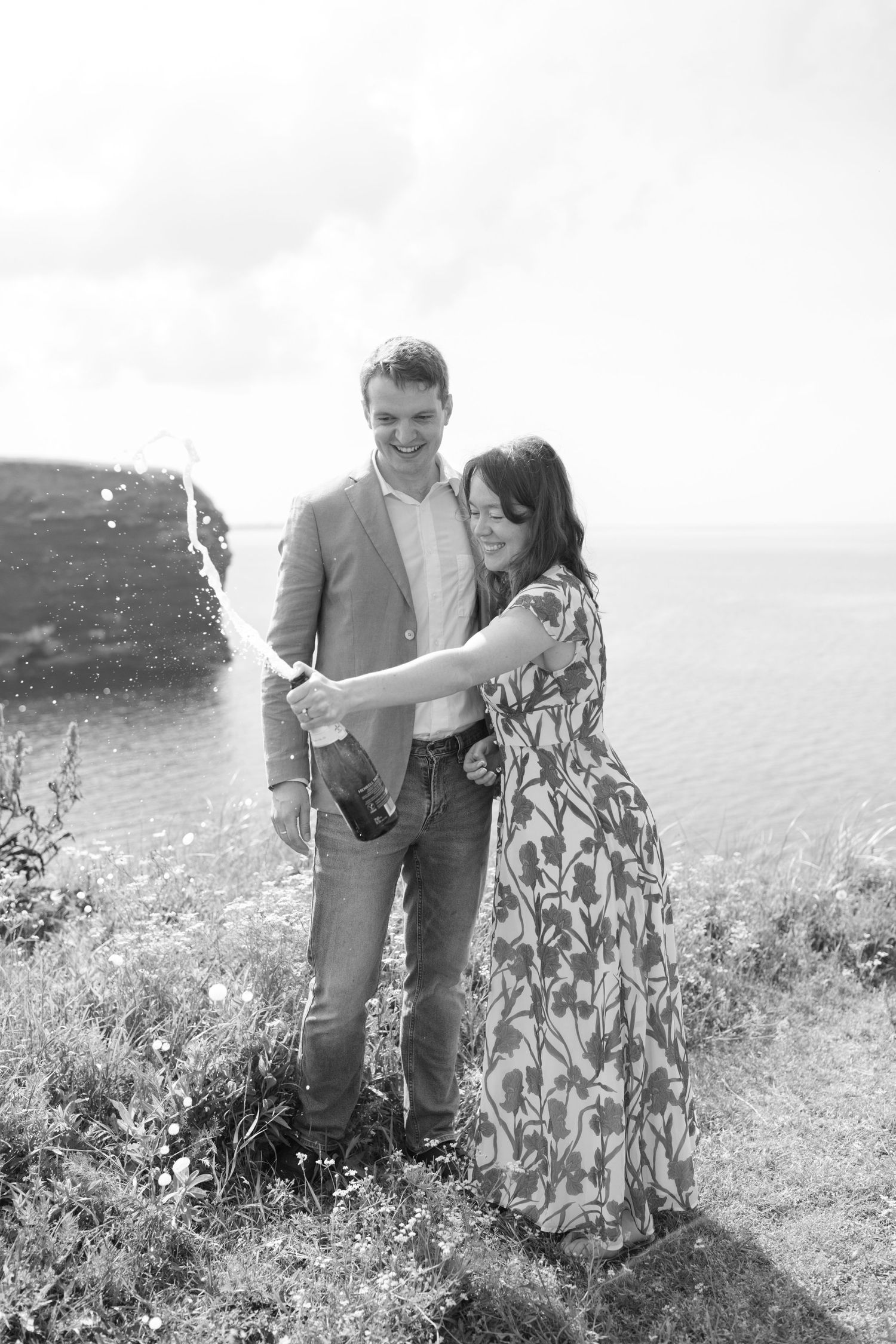 Couple poses during an outdoor engagement photography session.