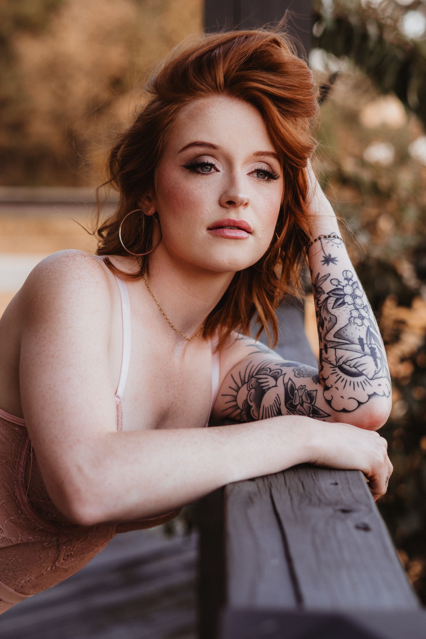 Artistic portrait with autumn tones and dramatic lighting.