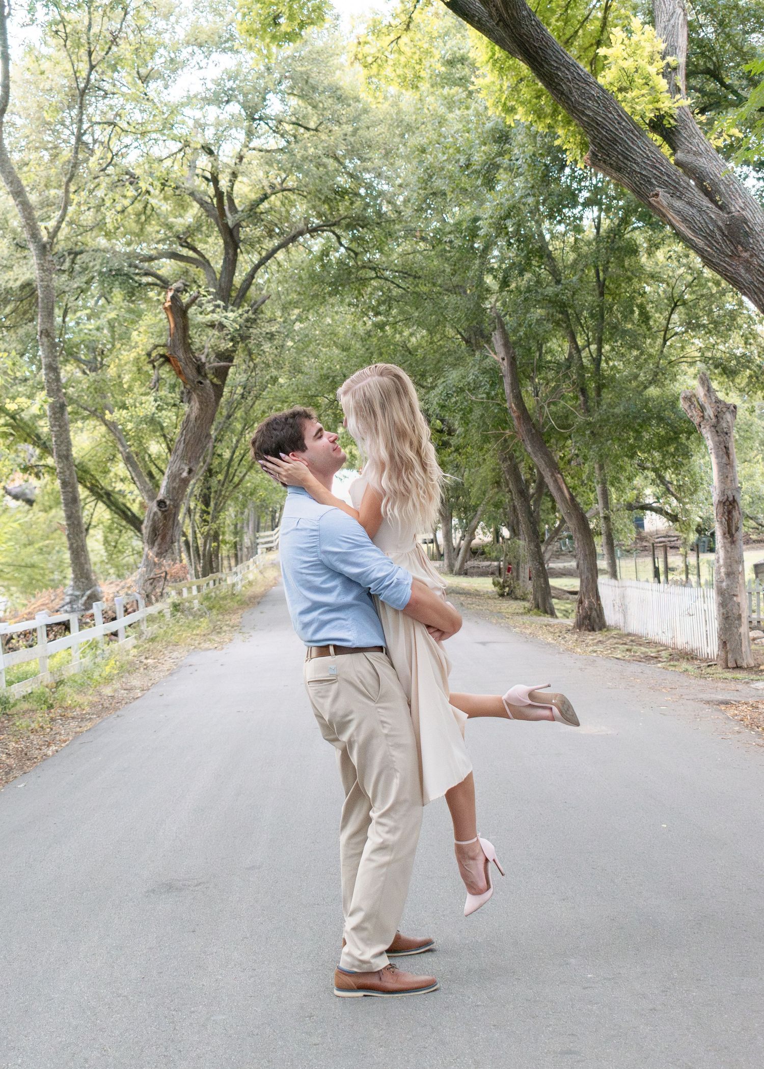Engaged couple dancing during session at Pace Park in Salado Texas