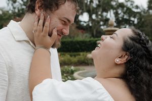 Intimate close-up of a couple sharing a romantic moment outdoors.