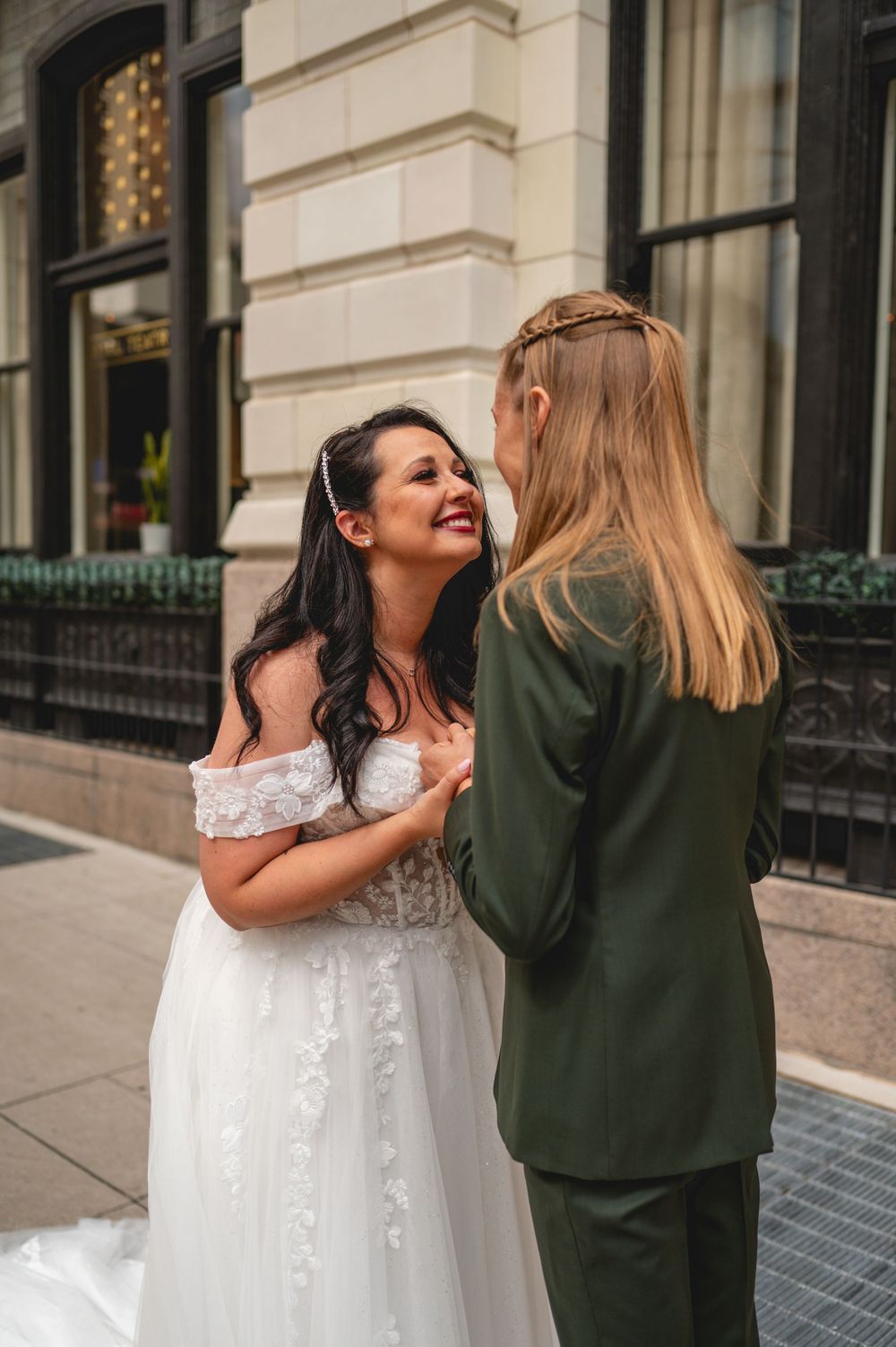 A wedding photoshoot showing a succession of candid moments in front of an elegant building facade.