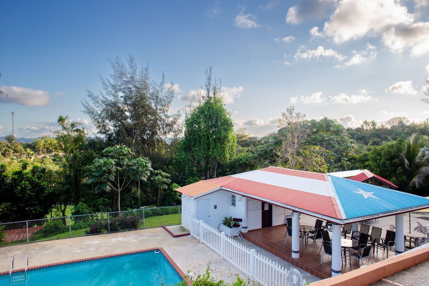 Real estate photo for a short-term rental in Aguas Buenas, Puerto Rico. Pool area.