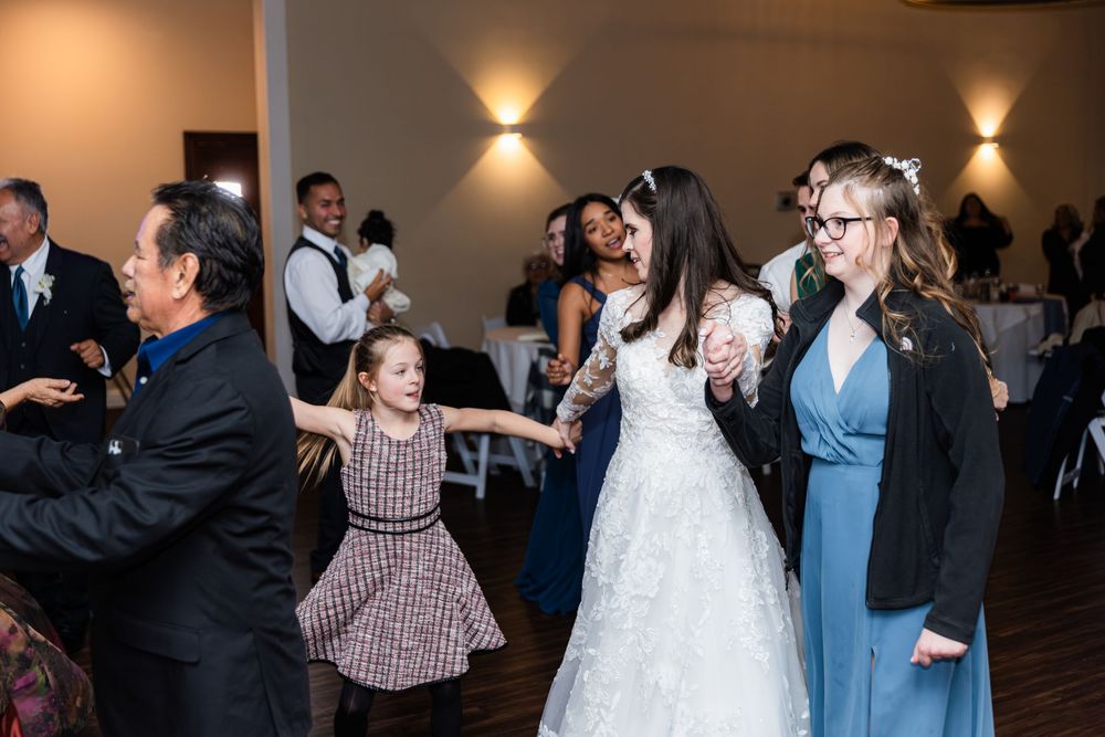 Dance sequence from a wedding celebration shows couples dancing and twirling together on the ballroom floor.