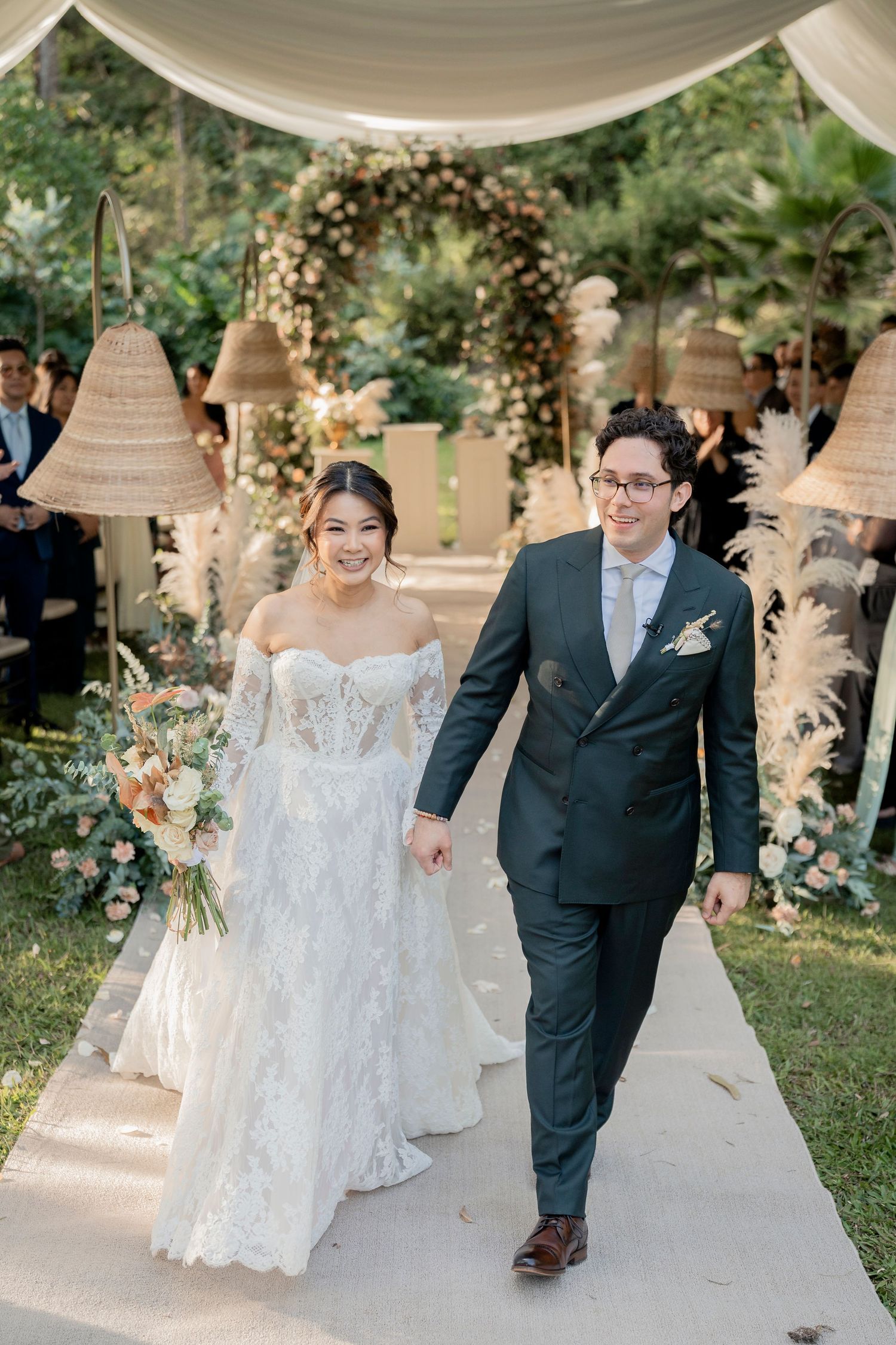 Elegant bridal portrait against tropical banana leaves and greenery in a romantic garden setting.