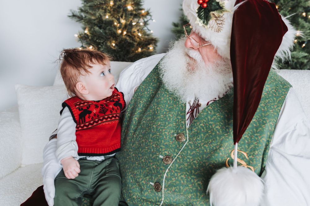 A series of holiday photos showing a child in a red sweater interacting with Santa Claus against a festive backdrop.
