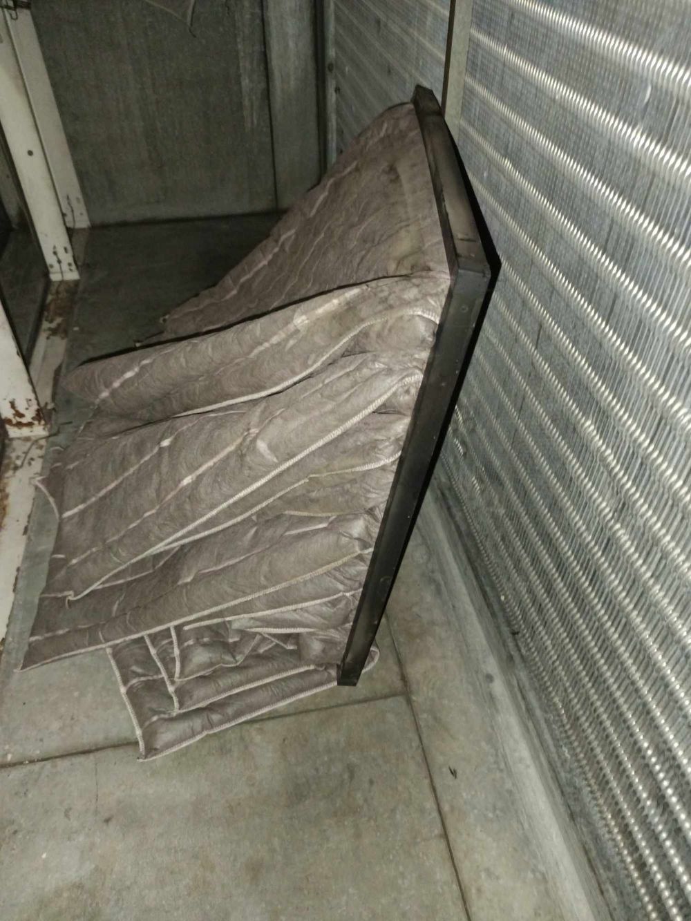 Industrial HVAC system components with metal ducting and insulation materials.