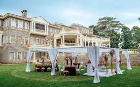 luxury garden wedding venue in Nairobi, captured by Nairobi Wedding Photographer, Bonnie Gichuru, showcasing lush greenery and flower arches