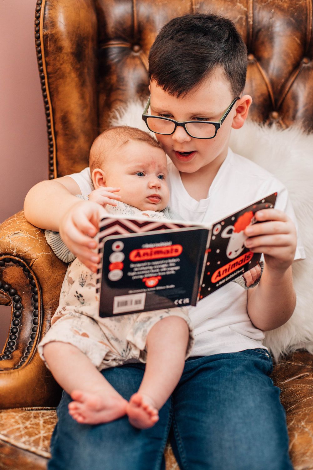 brother reading to baby