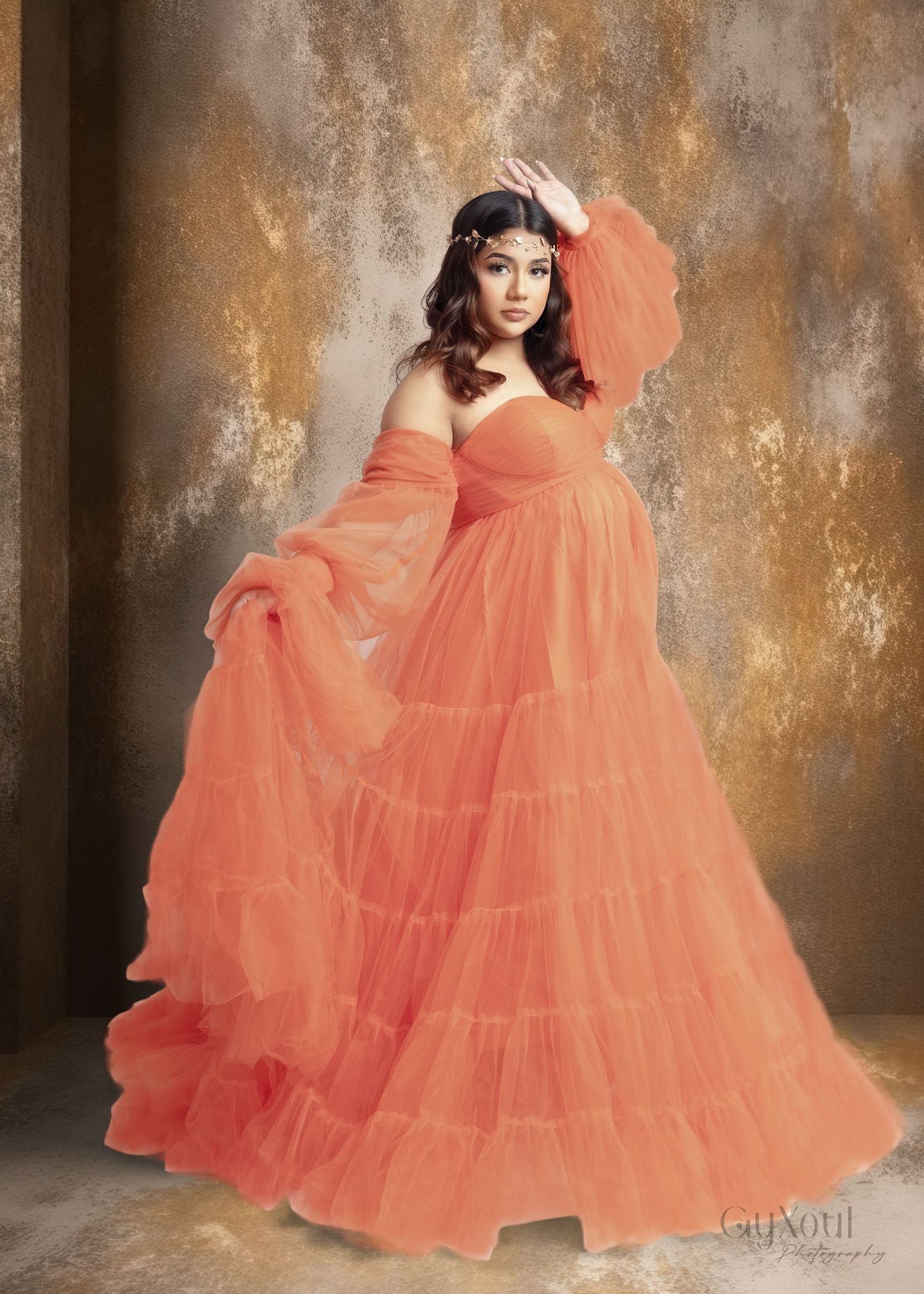 A series of fashion photos showing a flowing coral-colored ballgown with ruffled tulle layers against a textured backdrop.
