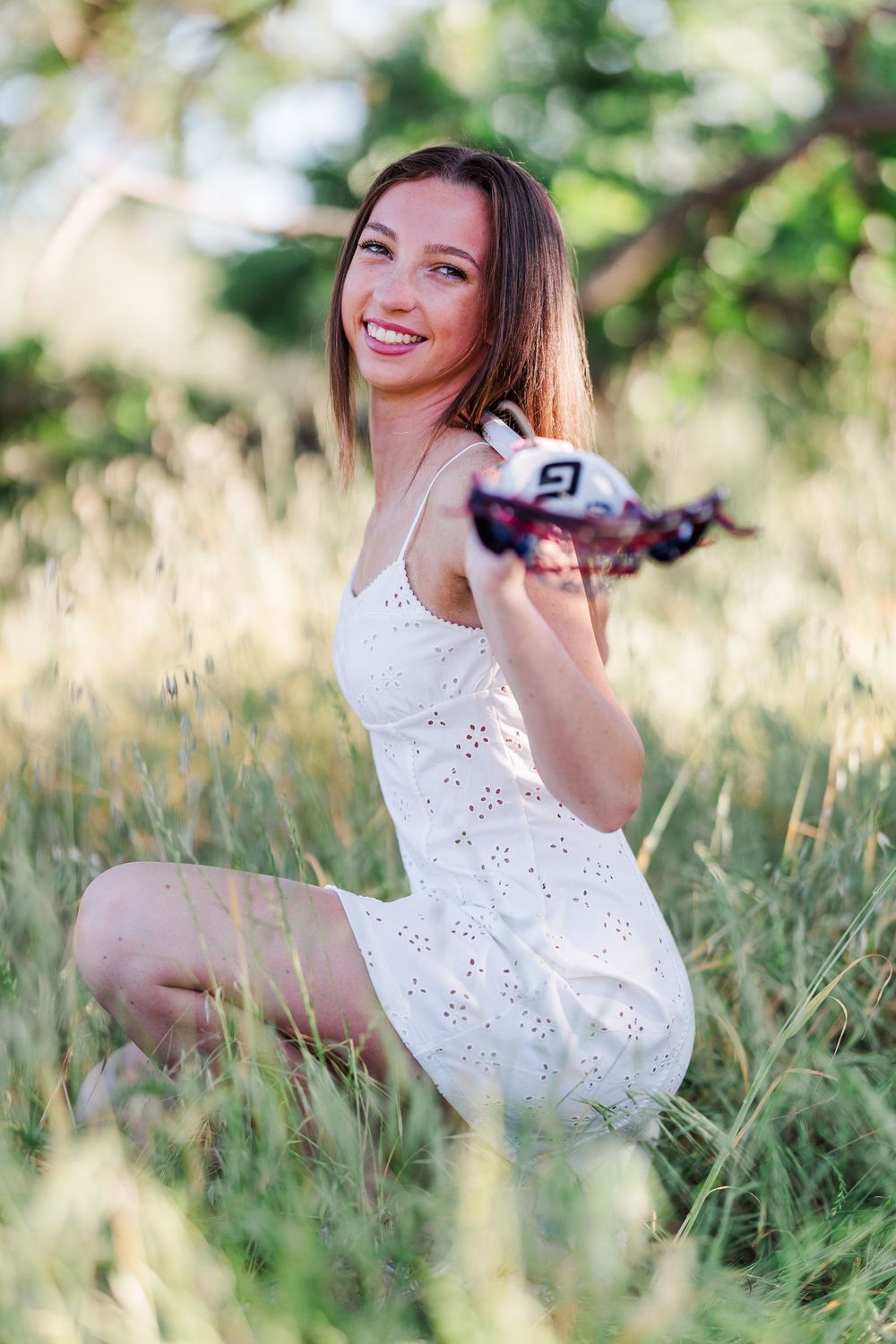 Simi High School twins posing in the hills of Simi Valley for outdoor graduation portraits, celebrating lacrosse and college milestones.