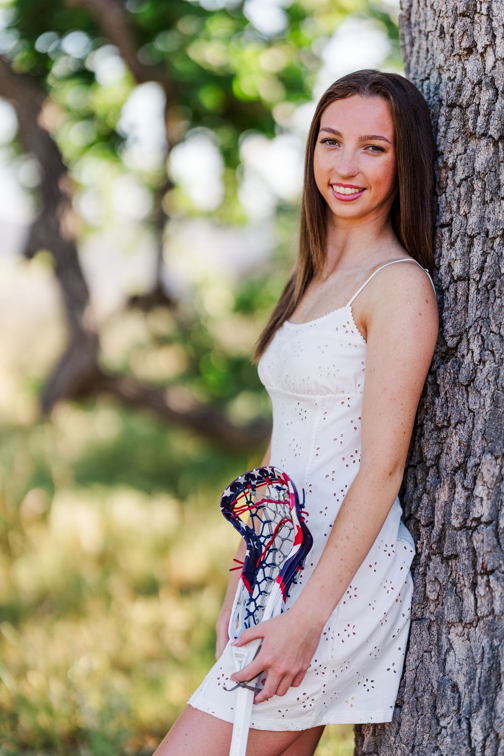 Simi High School twins posing in the hills of Simi Valley for outdoor graduation portraits, celebrating lacrosse and college milestones.