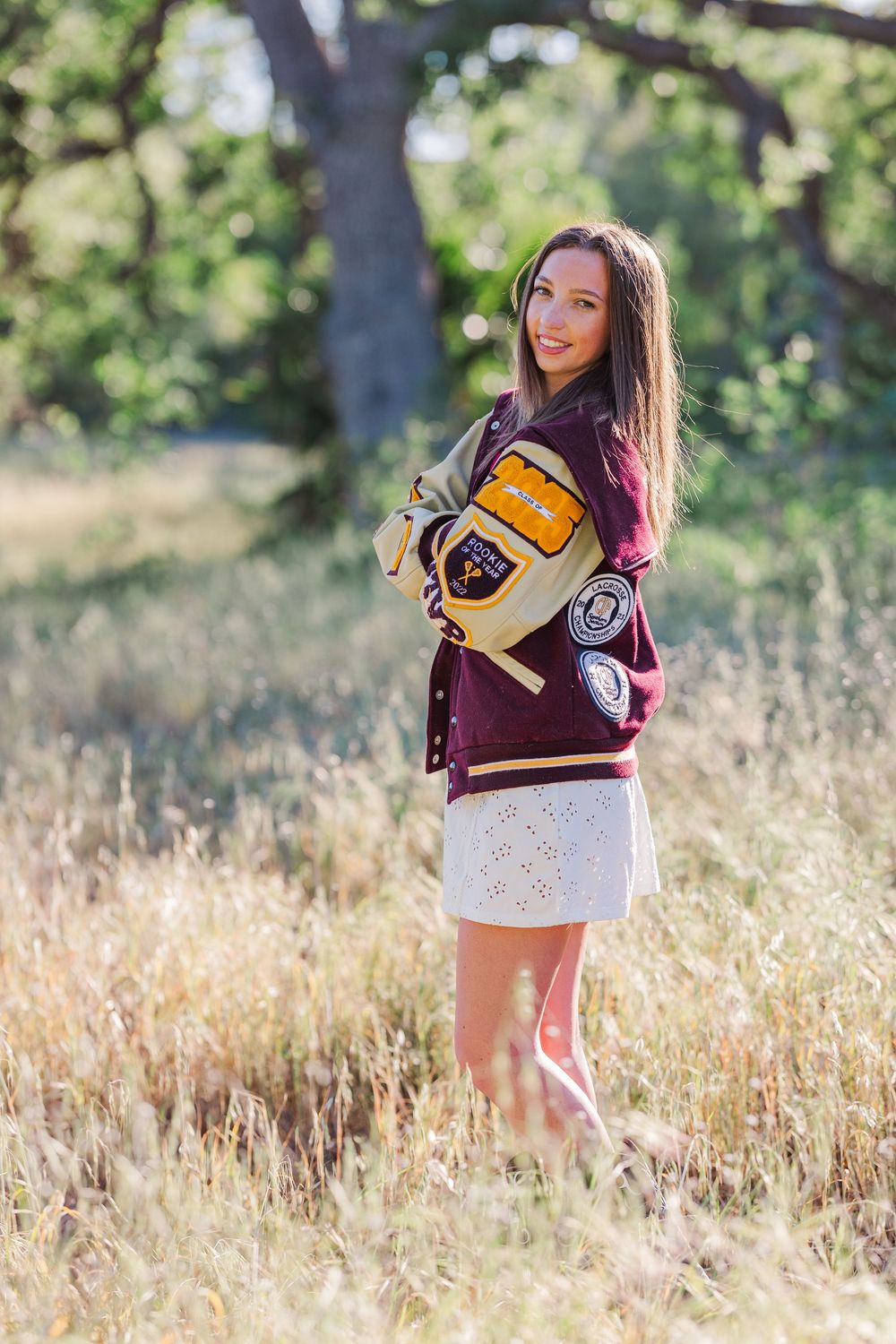 Simi High School twins posing in the hills of Simi Valley for outdoor graduation portraits, celebrating lacrosse and college milestones.