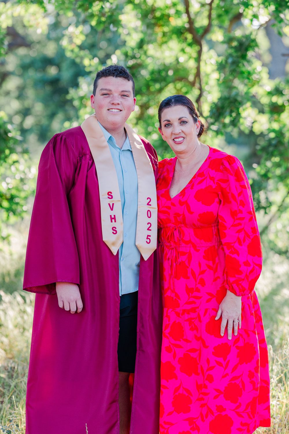 Simi High School twins posing in the hills of Simi Valley for outdoor graduation portraits, celebrating lacrosse and college milestones.