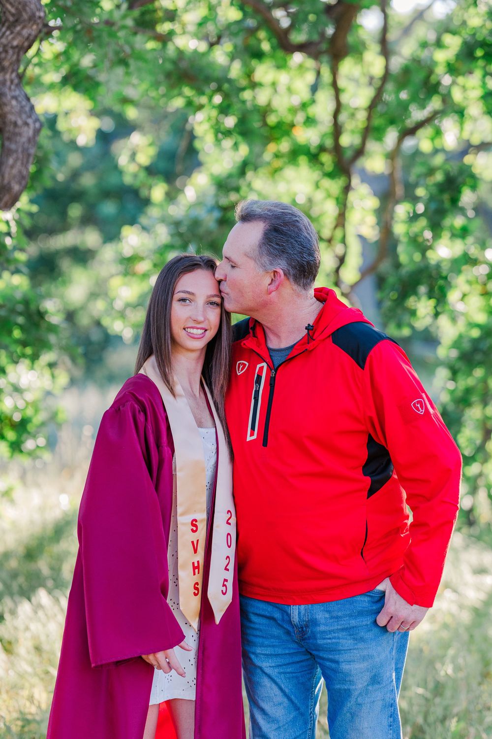 Simi High School twins posing in the hills of Simi Valley for outdoor graduation portraits, celebrating lacrosse and college milestones.