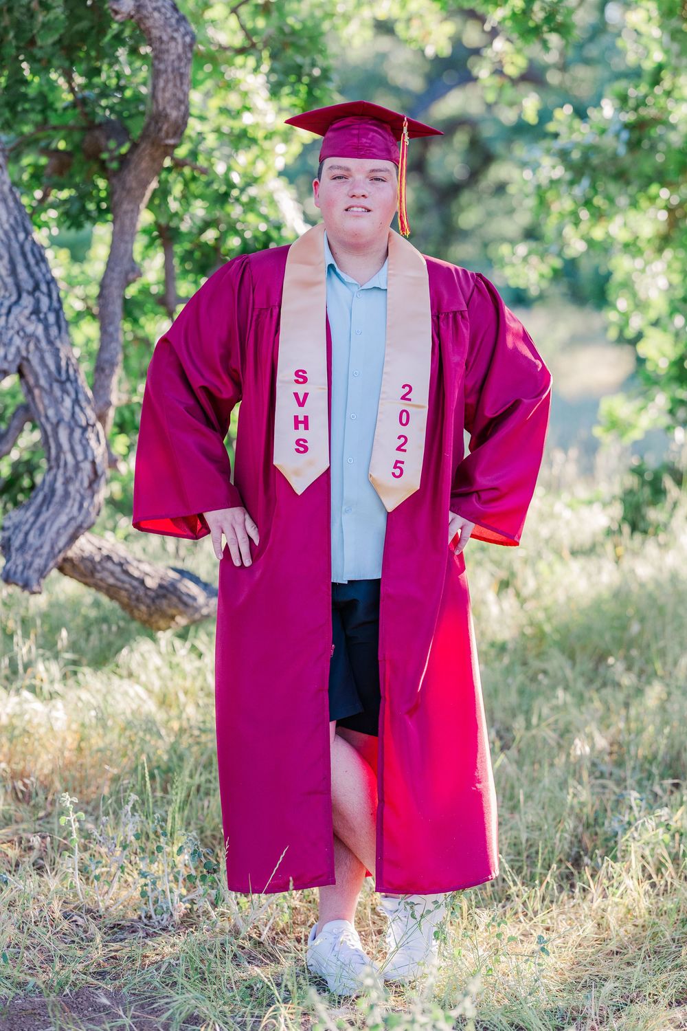 Simi High School twins posing in the hills of Simi Valley for outdoor graduation portraits, celebrating lacrosse and college milestones.