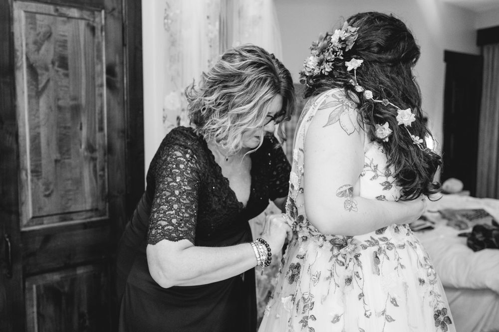 A black and white photo collage showing intimate moments and interactions between people at what appears to be a wedding.