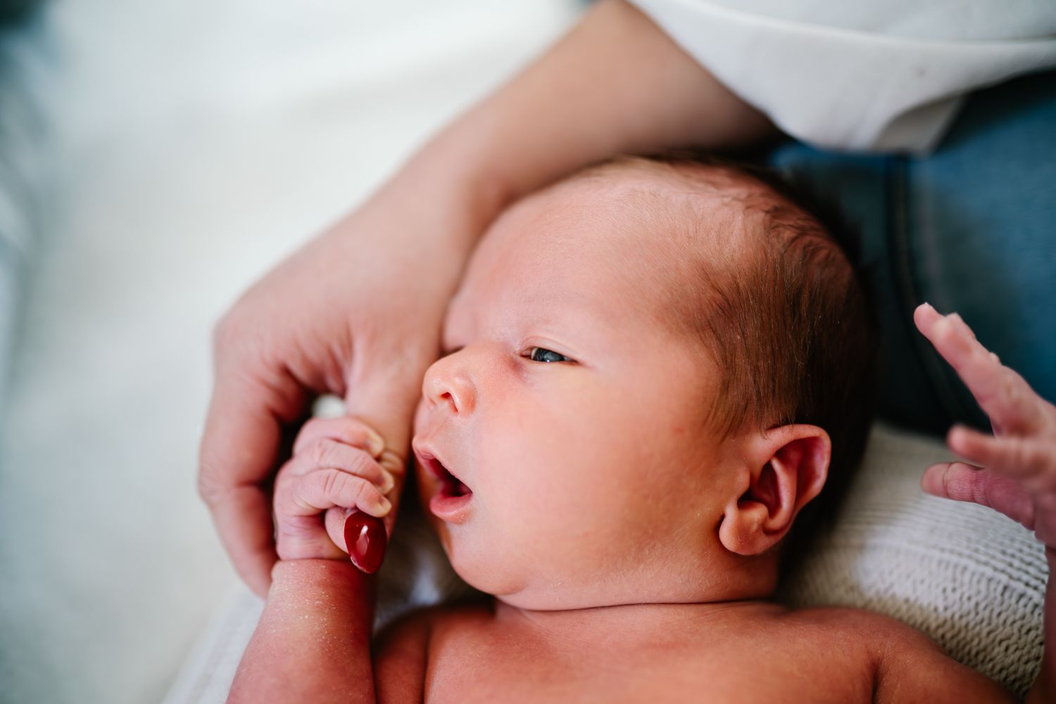 A series of peaceful newborn baby photos in soft lighting taken by Pei A Photography Melbourne newborn maternity family couples photographer