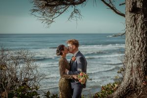 Scenic ocean view with waves crashing against rocky coastline under cloudy skies.