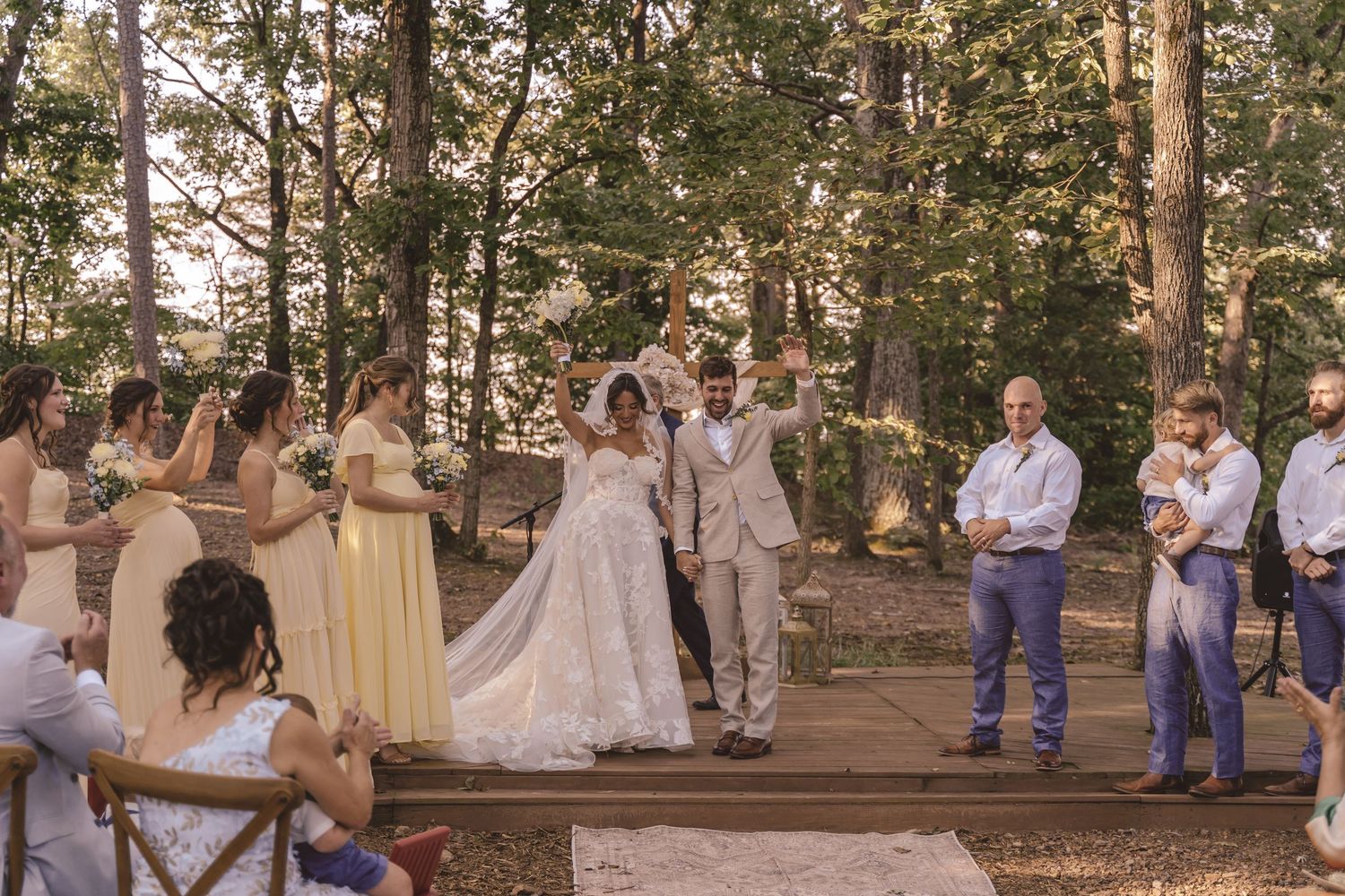 Newlyweds celebrating with wedding guests after the ceremony at Farmhouse Siloam in Mount Airy, NC