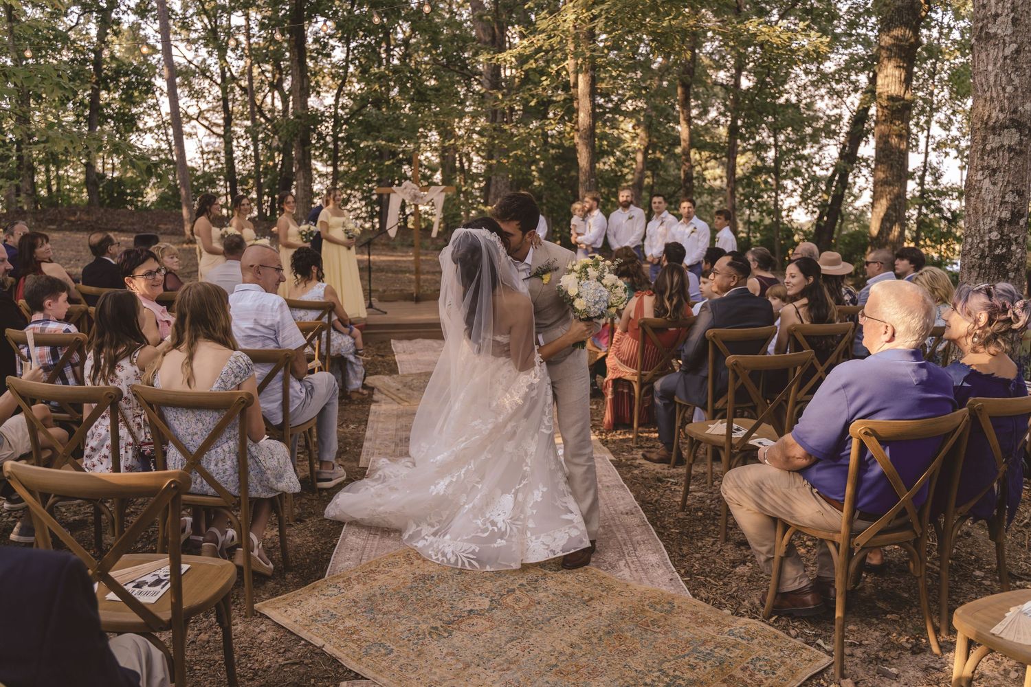 Newlyweds kissing after the wedding ceremony at Farmhouse Siloam in Mount Airy, NC