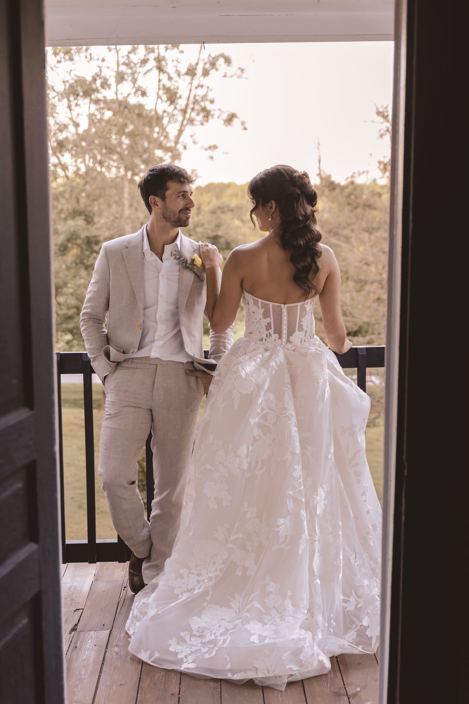 Bride and groom sharing a moment on the terrace at Farmhouse Siloam in Mount Airy, NC