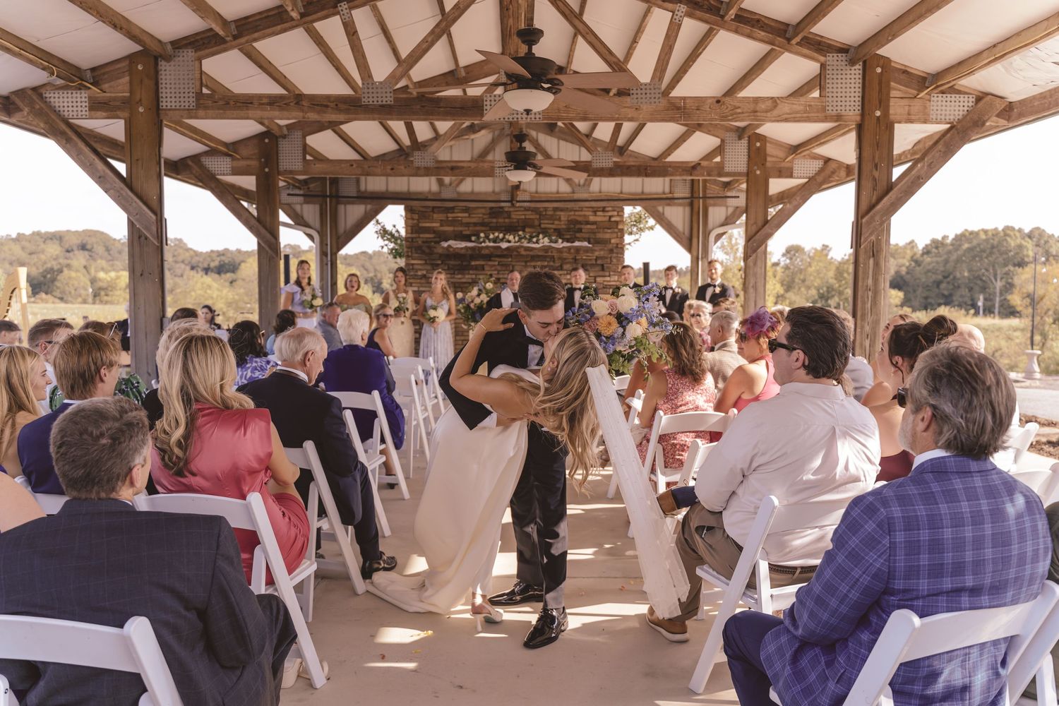 Newlyweds kissing after the ceremony at Willow and Stone Events in Mocksville, NC