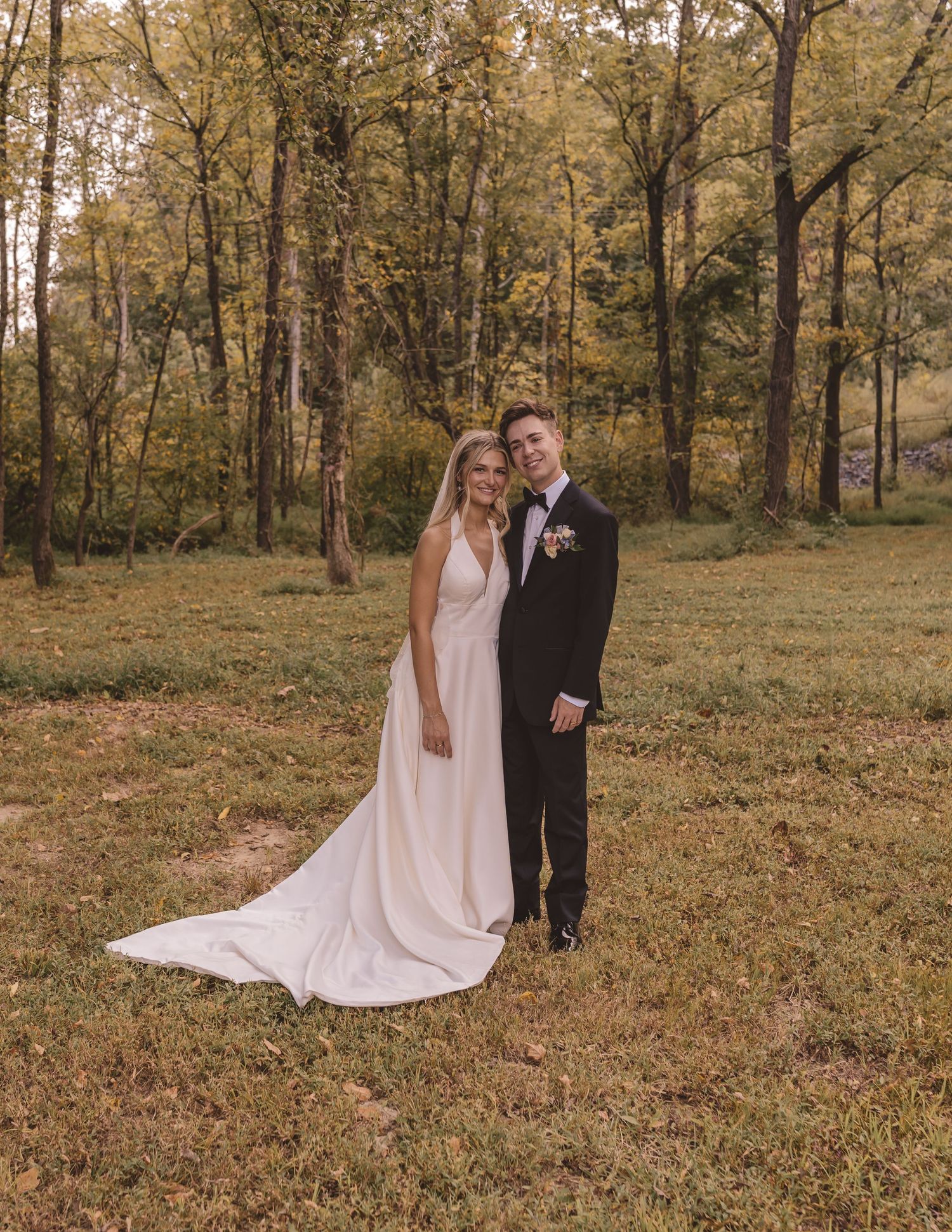 Bride and groom standing under the trees at Willow and Stone Events in Mocksville, NC