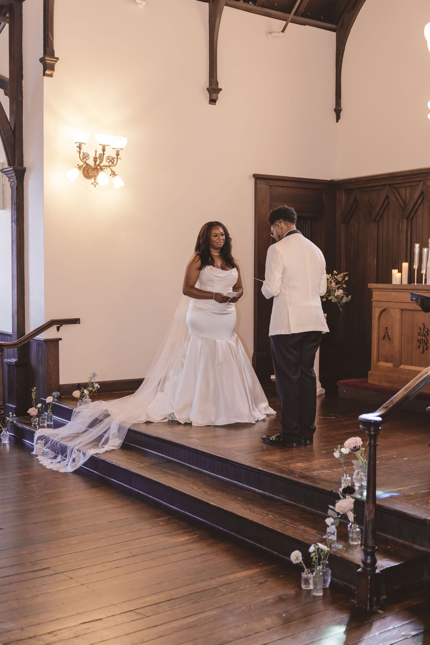 Groom reading his vows to his bride at the wedding ceremony at All Saints Chapel in Raleigh, NC