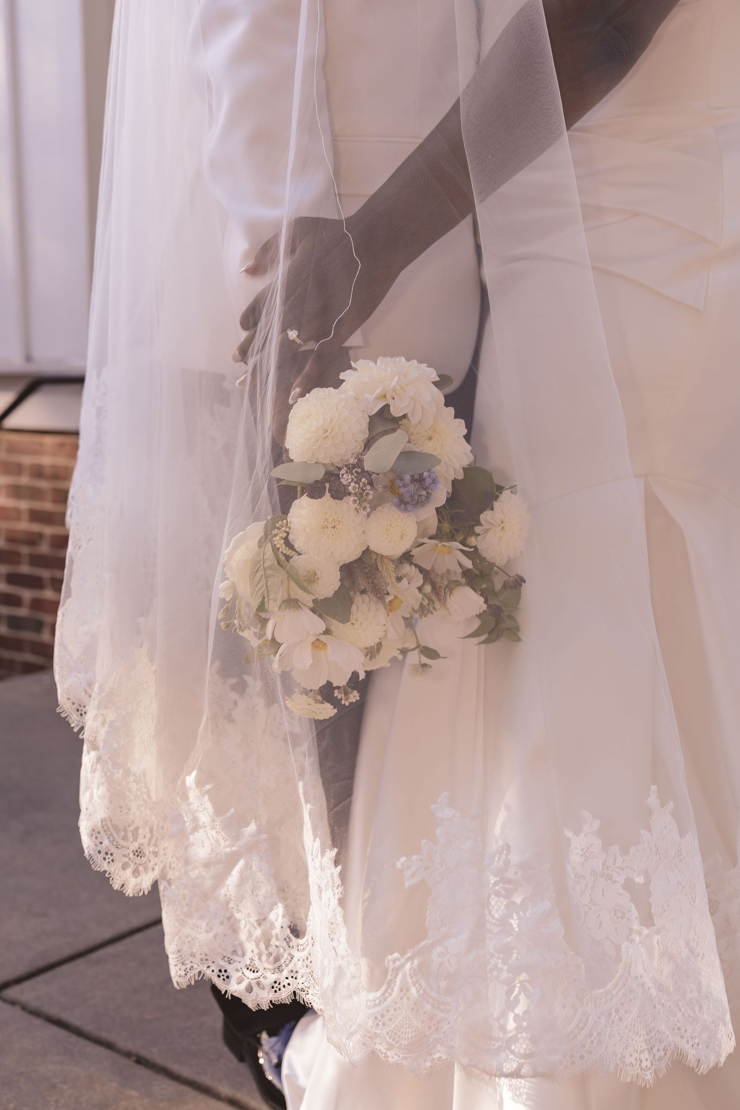 Bridal bouquet under the veil at All Saints Chapel in Raleigh, NC