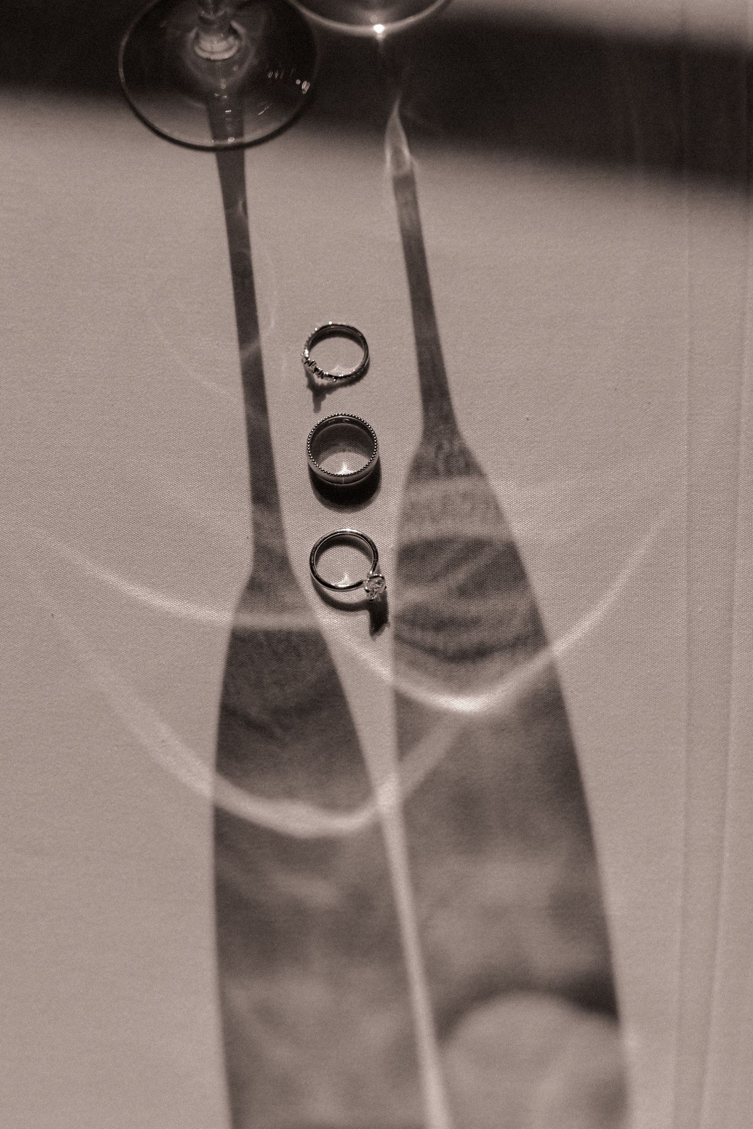 Wedding rings and champagne glass shadows at Omni Grove Park Inn in Asheville, NC