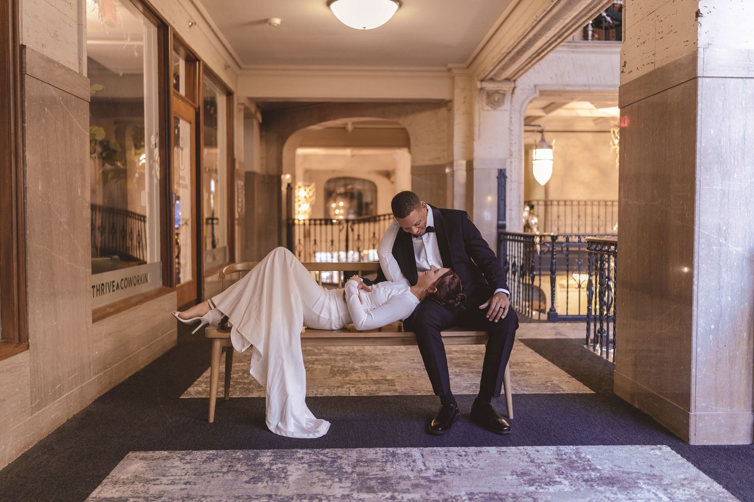 Bride and groom sharing a quiet moment in the hallway at the Grove Arcade in Asheville, NC