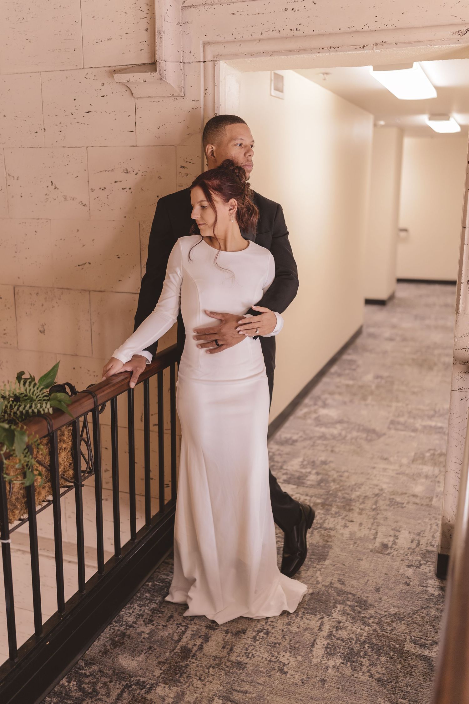 Bride and groom embracing at Grove Arcade in Asheville, NC