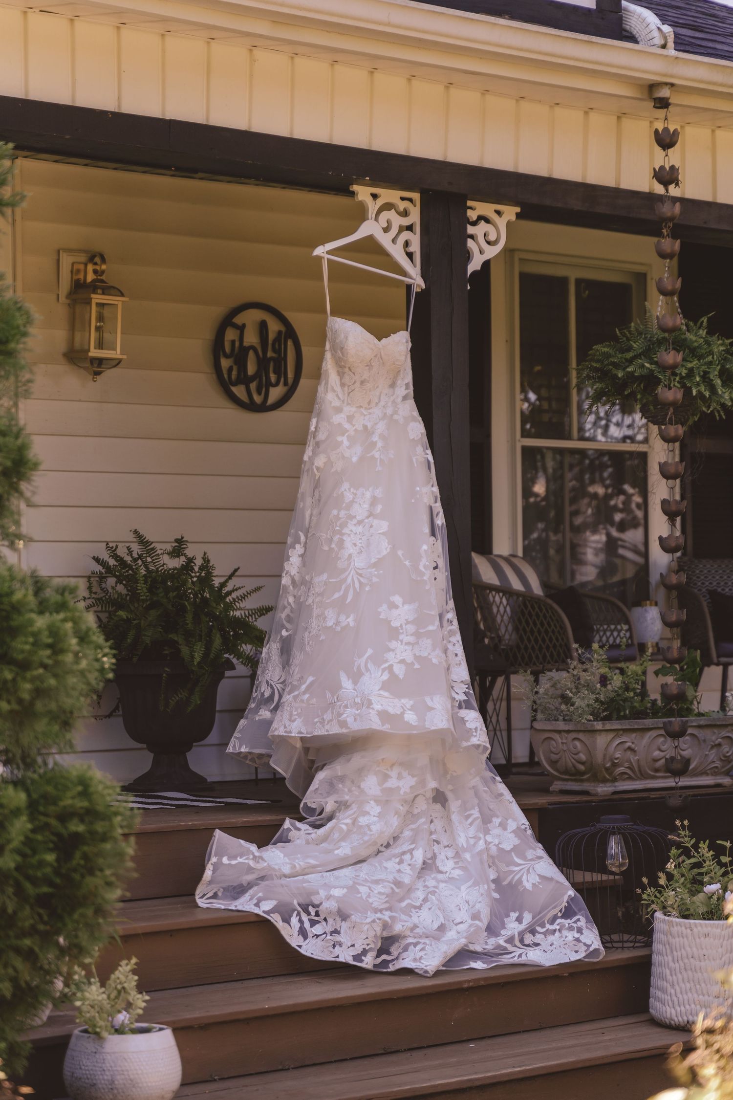 Wedding dress hanging on the porch at Farmhouse Siloam in Mount Airy, NC