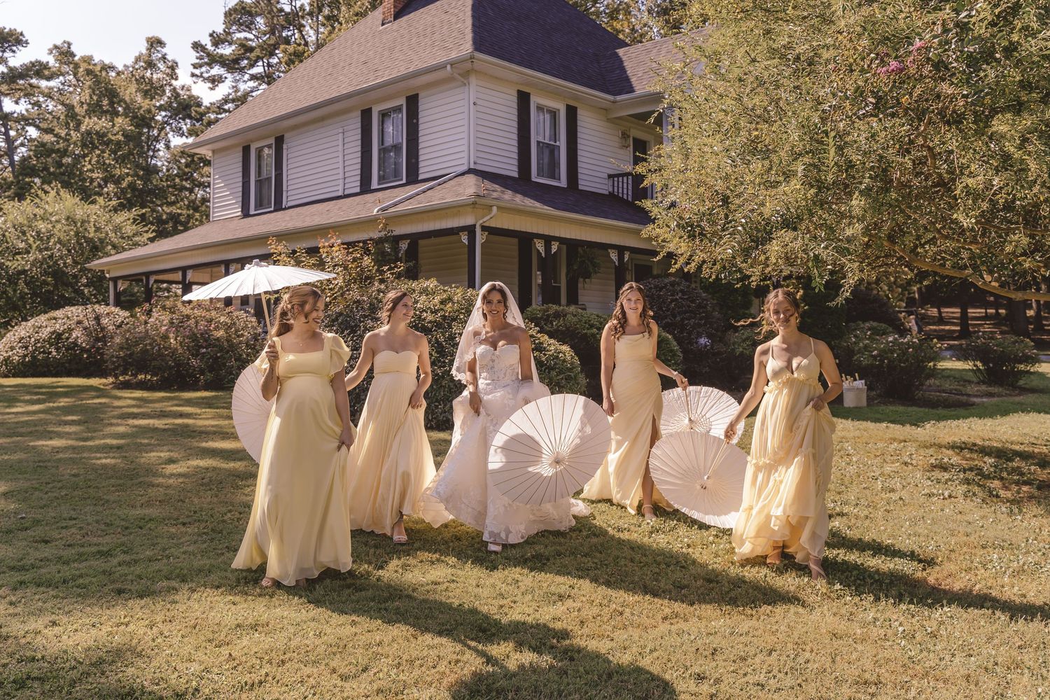 Bridal party walking together outdoors before the ceremony at Farmhouse Siloam in Mount Airy, NC