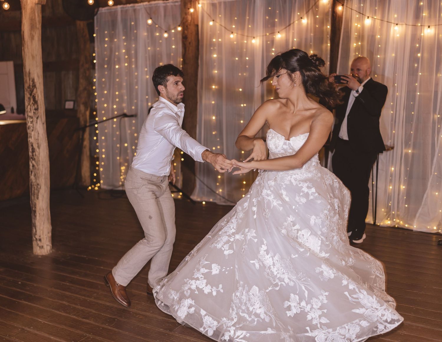Newlyweds dancing during the wedding reception at Farmhouse Siloam in Mount Airy, NC