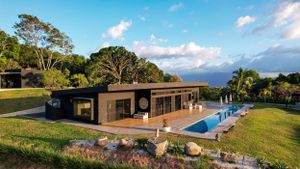 Entrance of a contemporary house with carved wooden doors and elegant design element