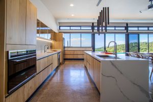 Expansive outdoor terrace with panoramic views of mountains and ocean
