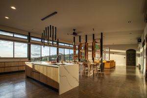 Dining area overlooking the pool, designed for indoor-outdoor living