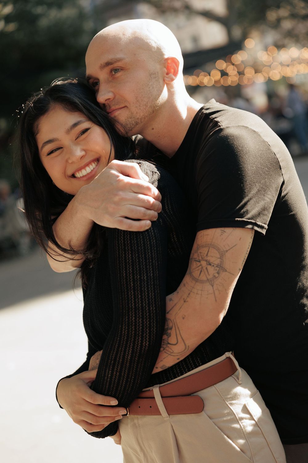 A couple embraces outdoors in warm sunlight, sharing intimate moments across a series of romantic candid photos.