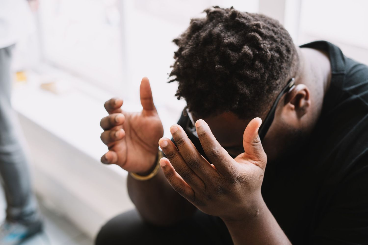 Man praying during worship at a Christian event with the ekklesia in London UK. Faith based photographer London Jenny Catlow