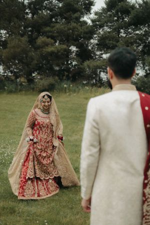 Beautiful outdoor scene with traditional wedding attire in a natural setting.