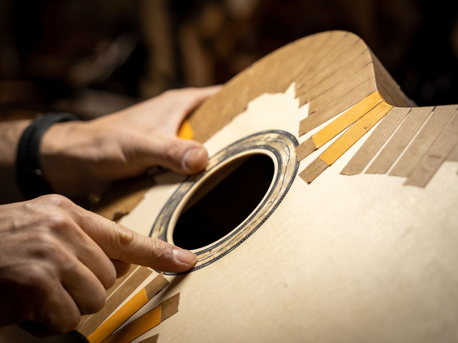 Photo of Luthier Max Sipe and one of his hand made guitars. Photo taken by Chris Brecht for Portland Magazine.