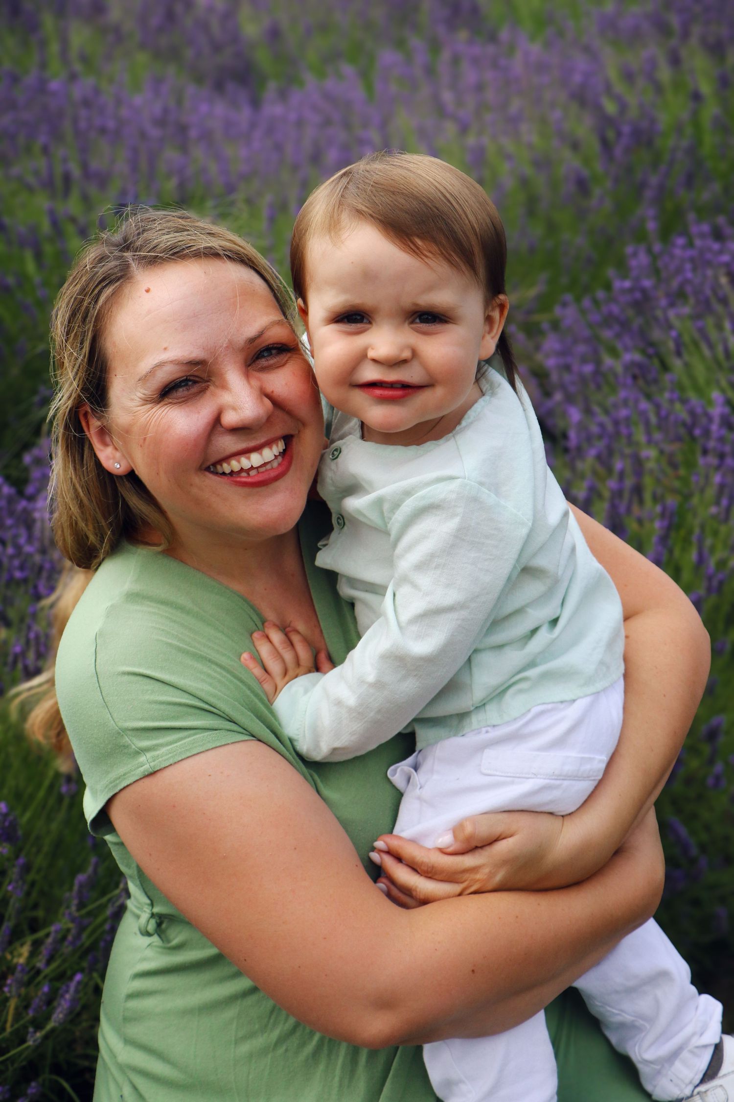A series of joyful moments captured in a blooming lavender field with people embracing and sharing smiles.