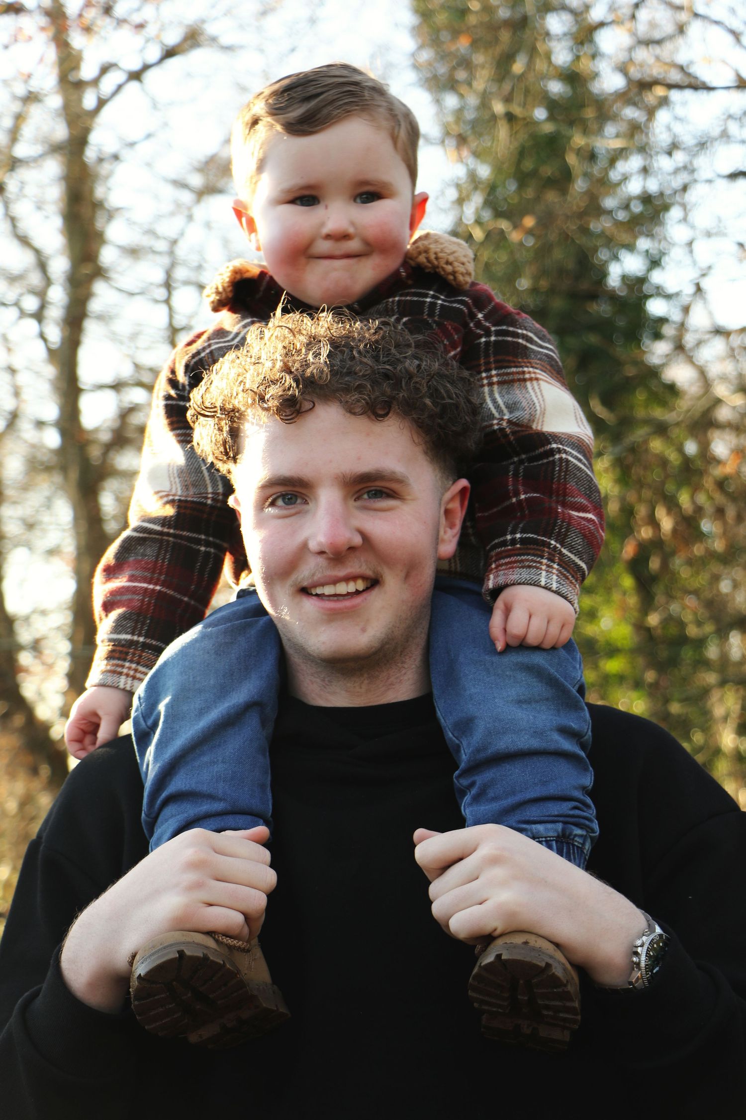 Three similar photos showing a young child riding on someone's shoulders outdoors with trees in the background.
