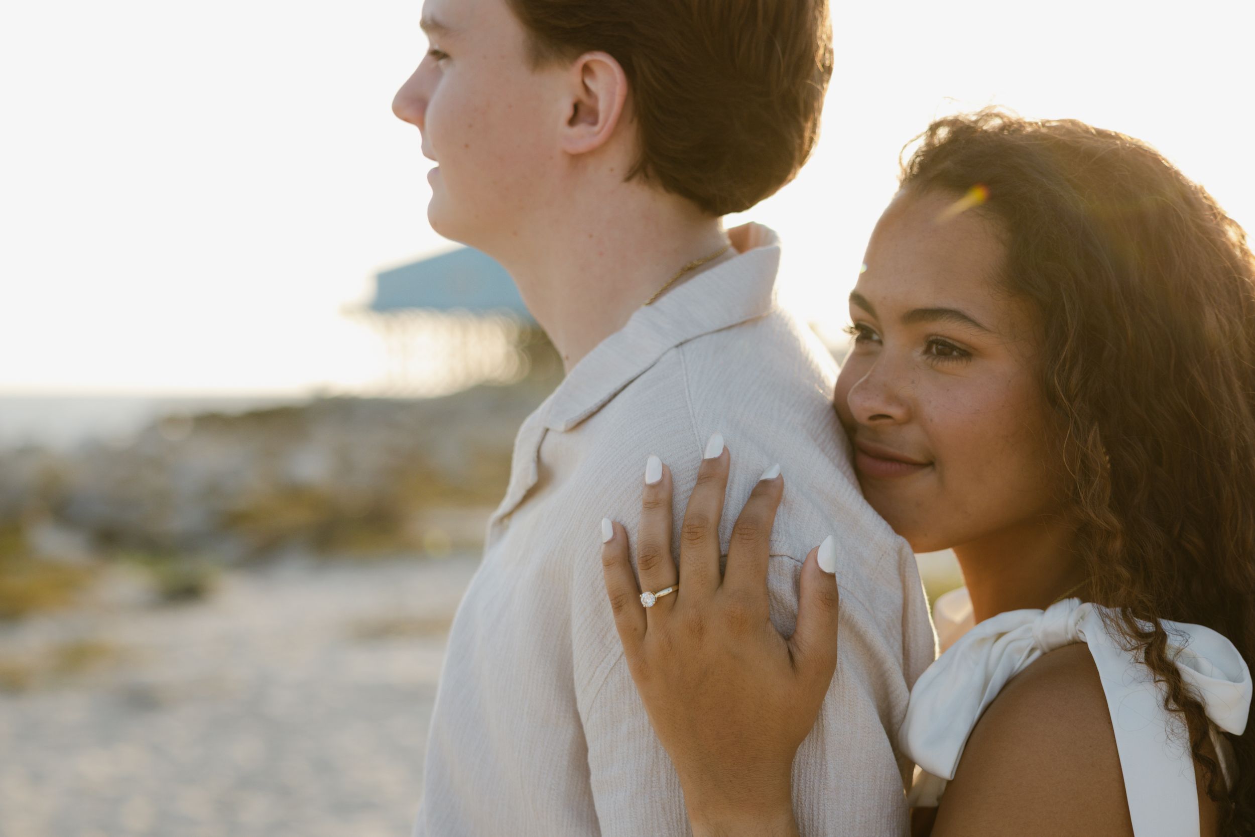 Evening golden hour engagement photos on a beach in Florida.