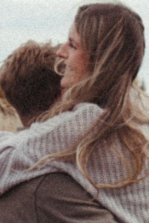 An intimate close-up moment captured in warm tones with soft focus.