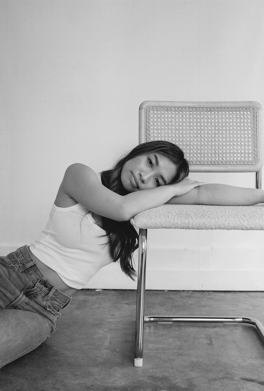 Minimalist black and white photos showing resting poses on a modern bench.